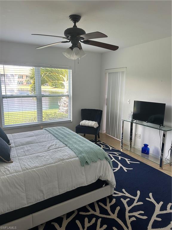 1950 West Crown Pointe Boulevard, Unit B106 Naples, FL 34112 - Photo 23 of 33 a bedroom with a bed and a window