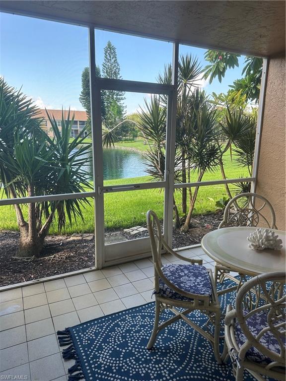 1950 West Crown Pointe Boulevard, Unit B106 Naples, FL 34112 - Photo 31 of 33 a backyard of a house with seating space