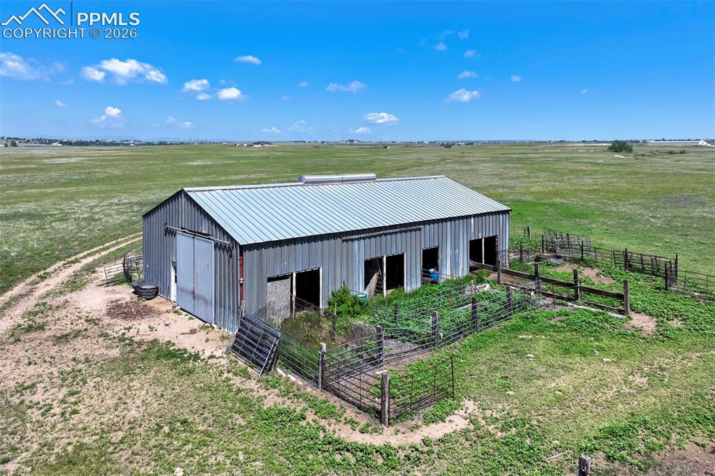 2550 Slocum Road Peyton, CO 80831 - Photo 11 of 50 a house view with a garden space