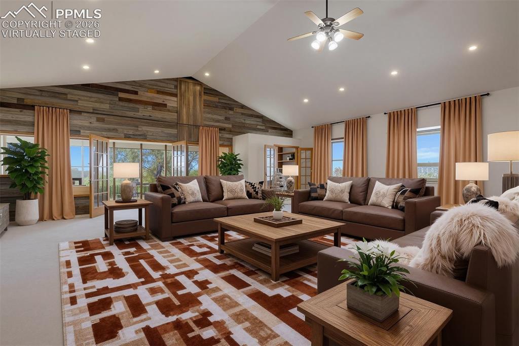 2550 Slocum Road Peyton, CO 80831 - Photo 18 of 50 a living room with furniture and a chandelier