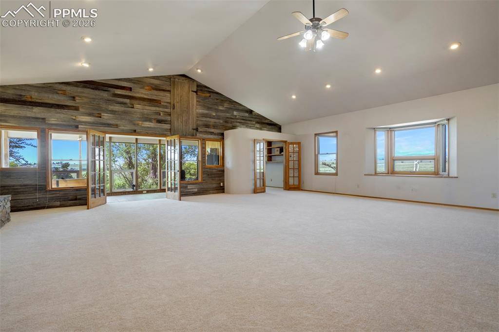 2550 Slocum Road Peyton, CO 80831 - Photo 19 of 50 a very nice looking room with a large window and chandelier