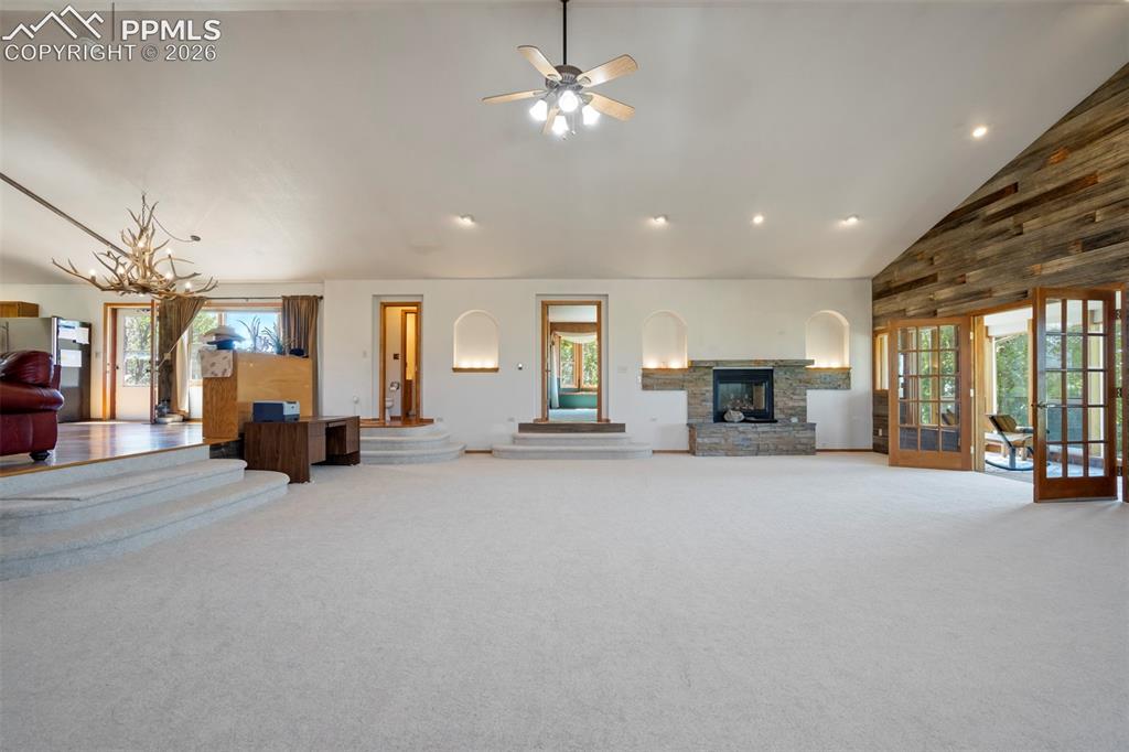 2550 Slocum Road Peyton, CO 80831 - Photo 20 of 50 a living room with furniture and a chandelier