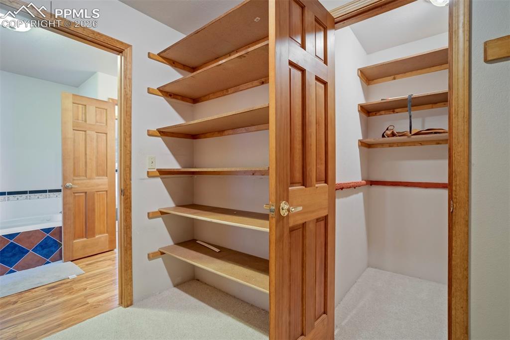 2550 Slocum Road Peyton, CO 80831 - Photo 39 of 50 a view of walk in closet with empty racks