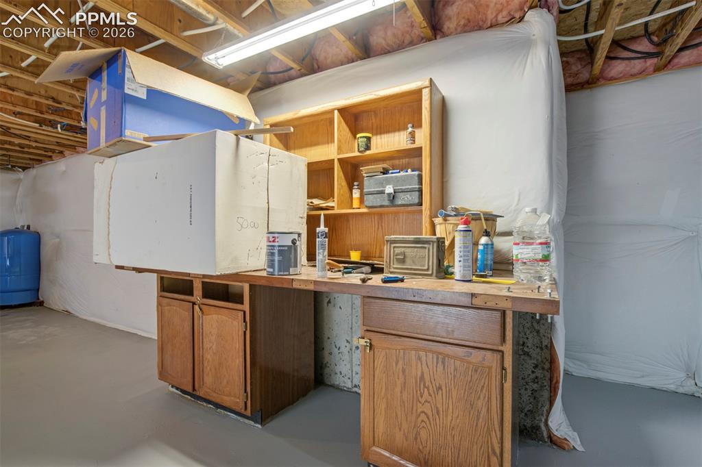 2550 Slocum Road Peyton, CO 80831 - Photo 45 of 50 a kitchen with stainless steel appliances granite countertop a sink and a refrigerator
