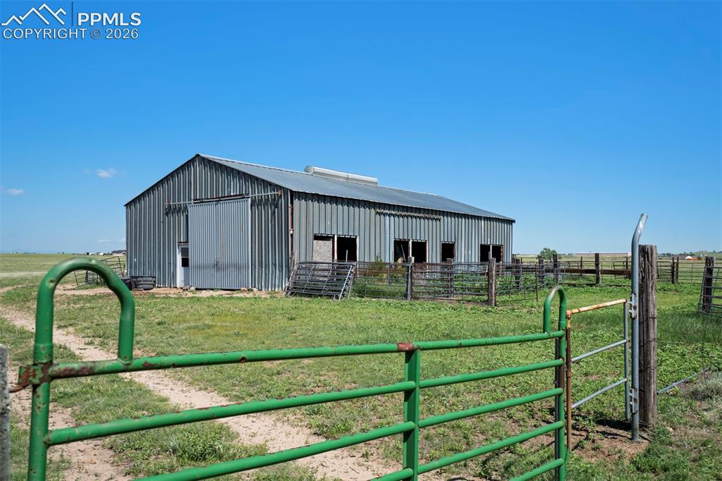 2550 Slocum Road Peyton, CO 80831 - Photo 10 of 50 a front view of a house with garden