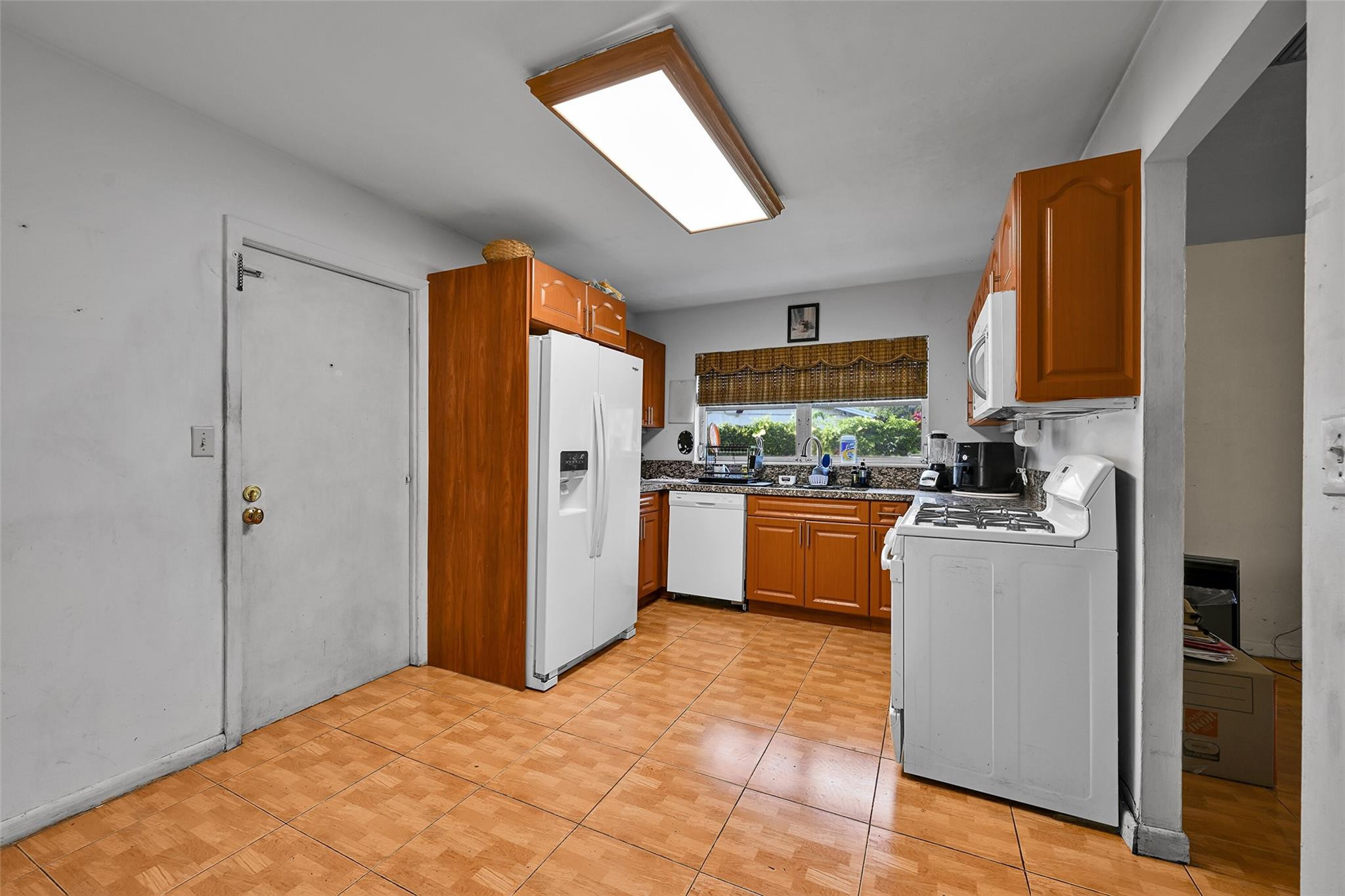 13615 Southwest 72nd Terrace Miami, FL 33183 - Photo 11 of 27 a kitchen with stainless steel appliances a refrigerator and a stove top oven