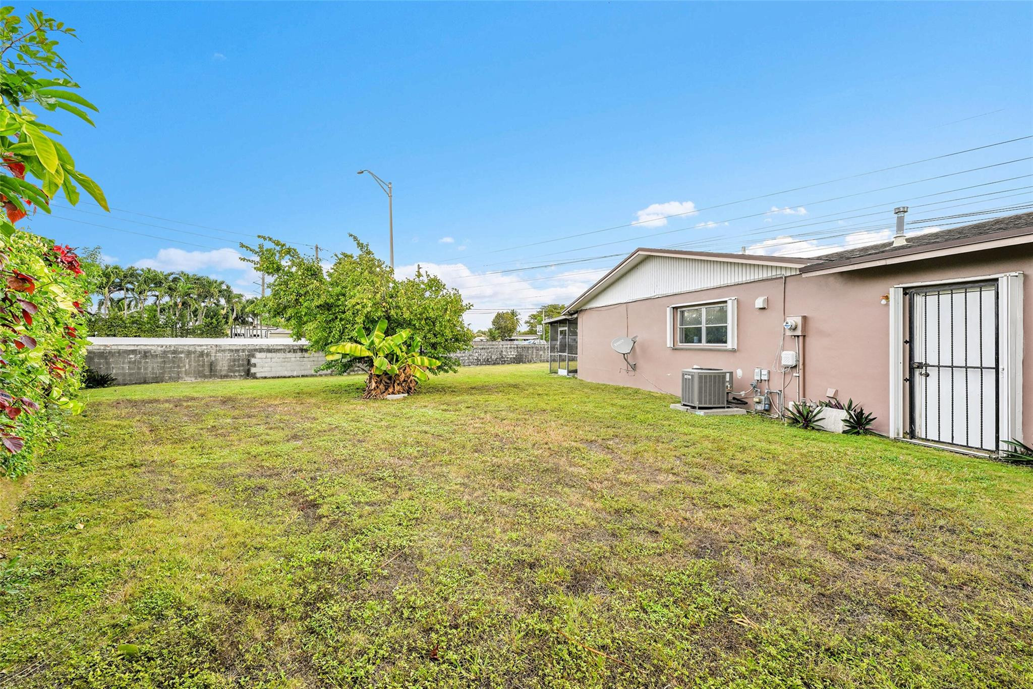 13615 Southwest 72nd Terrace Miami, FL 33183 - Photo 21 of 27 a view of a backyard with plants and a garden