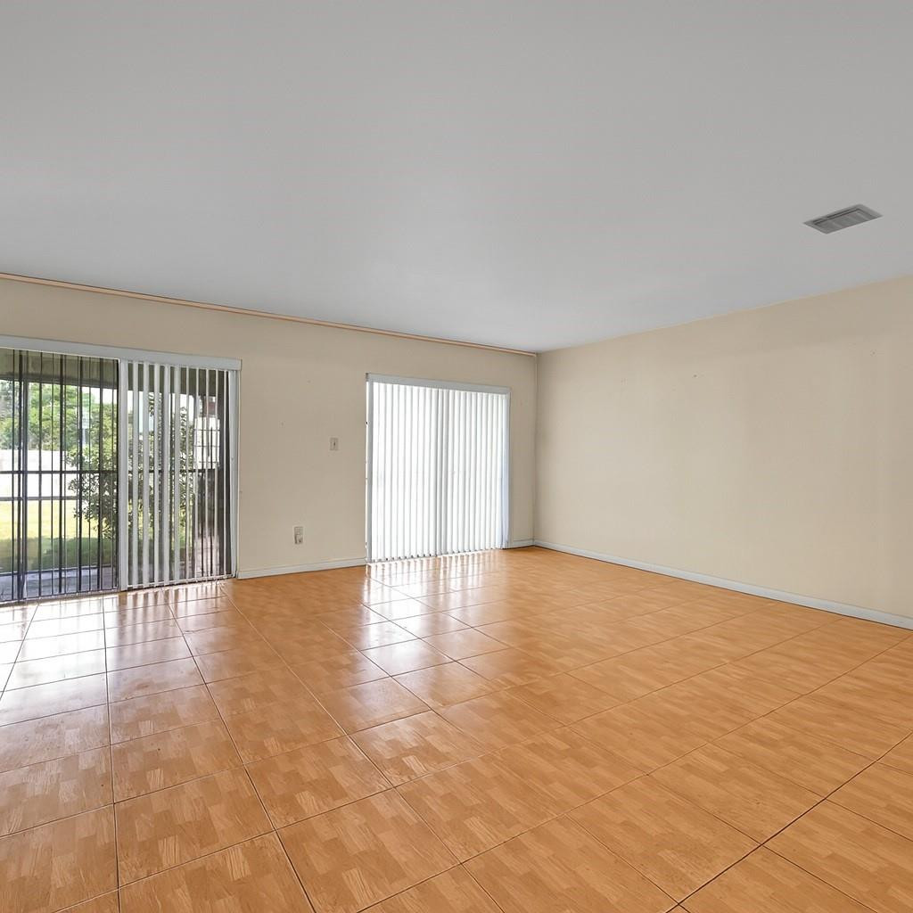 13615 Southwest 72nd Terrace Miami, FL 33183 - Photo 4 of 27 a view of an empty room with a window