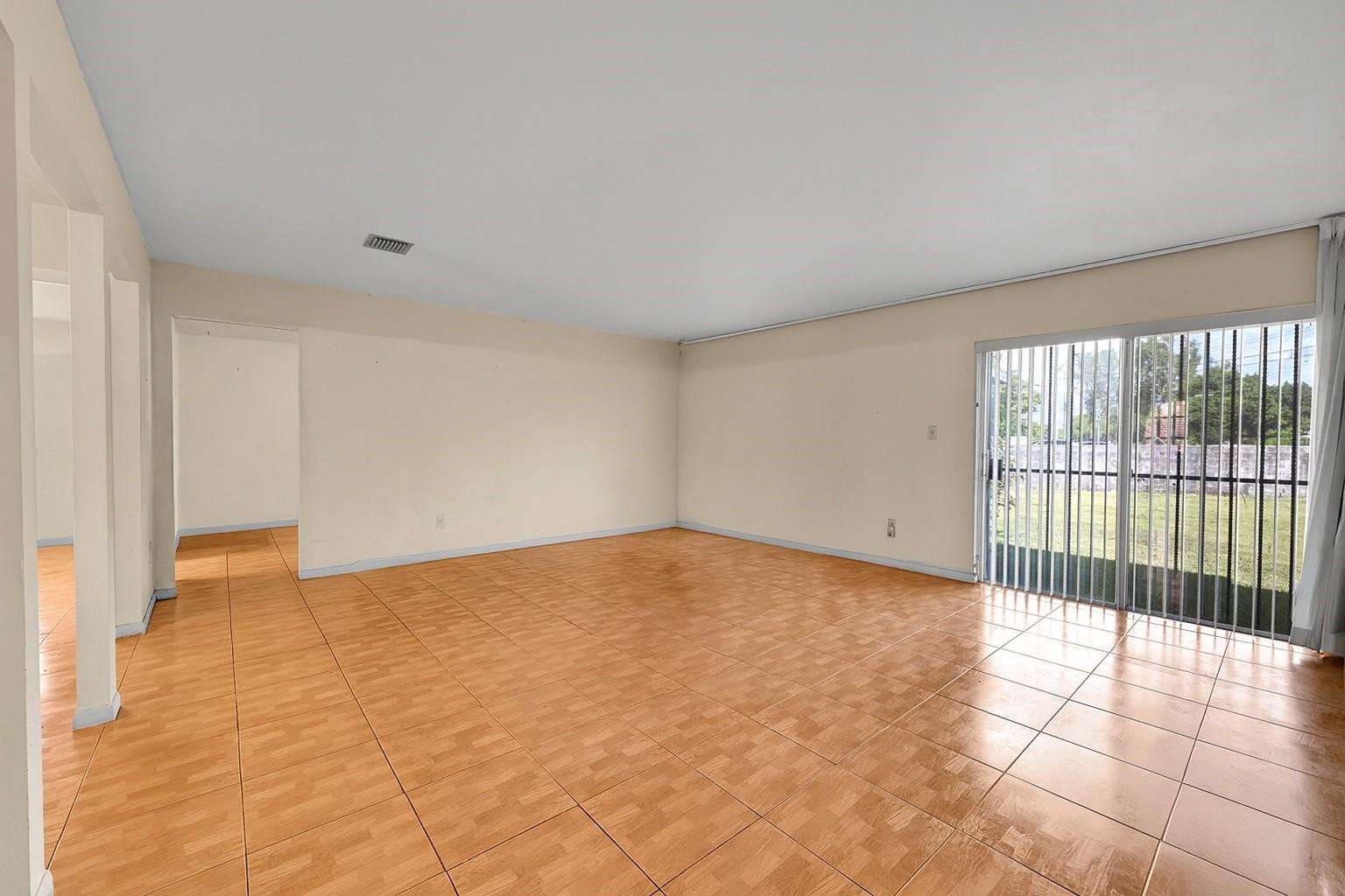 13615 Southwest 72nd Terrace Miami, FL 33183 - Photo 5 of 27 a view of an empty room and window