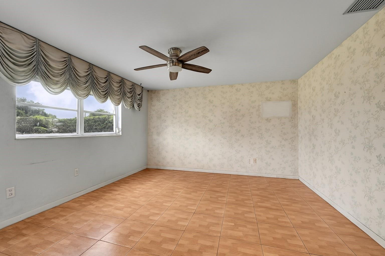 13615 Southwest 72nd Terrace Miami, FL 33183 - Photo 7 of 27 a view of empty room with wooden floor and fan