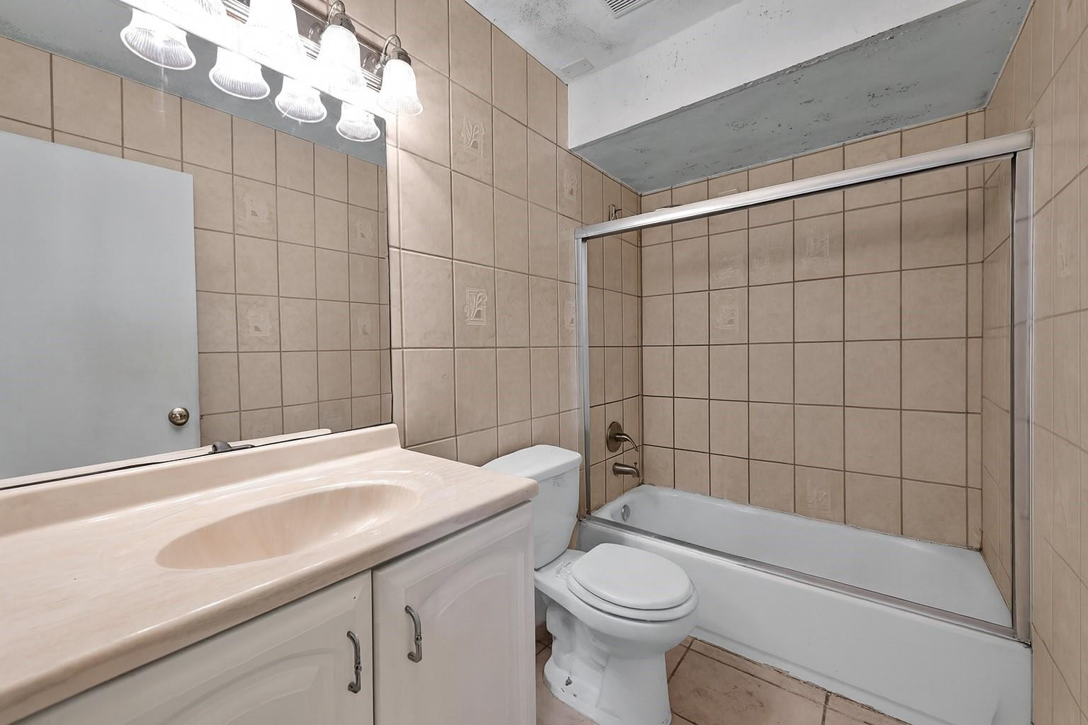 13615 Southwest 72nd Terrace Miami, FL 33183 - Photo 9 of 27 a bathroom with a sink a toilet and shower