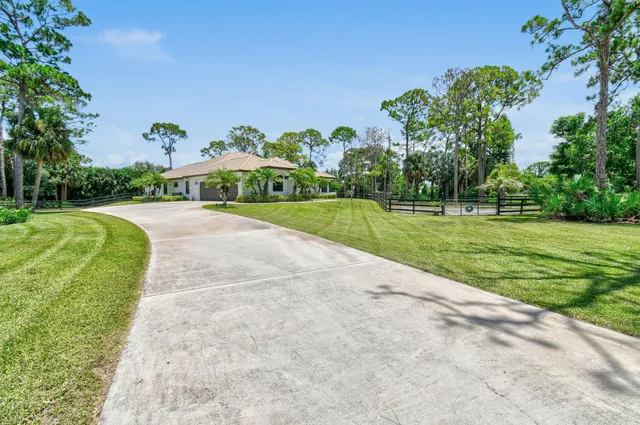 a view of a garden with a house
