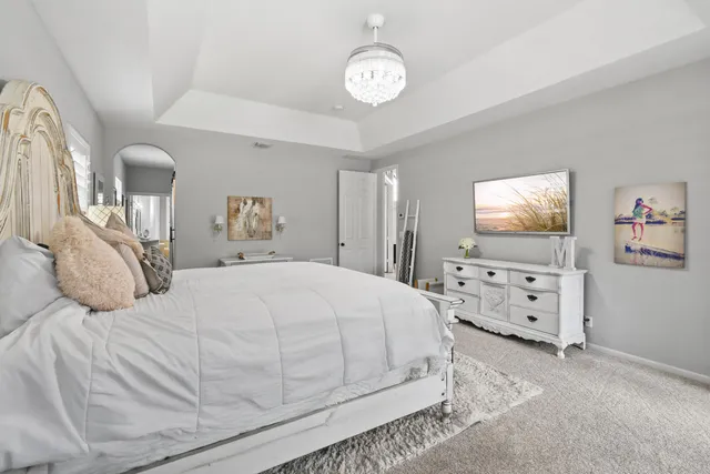 a bedroom with furniture and a window