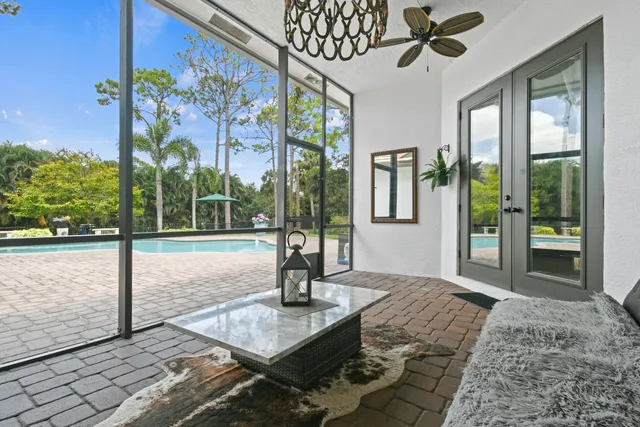 a view of a swimming pool with a yard