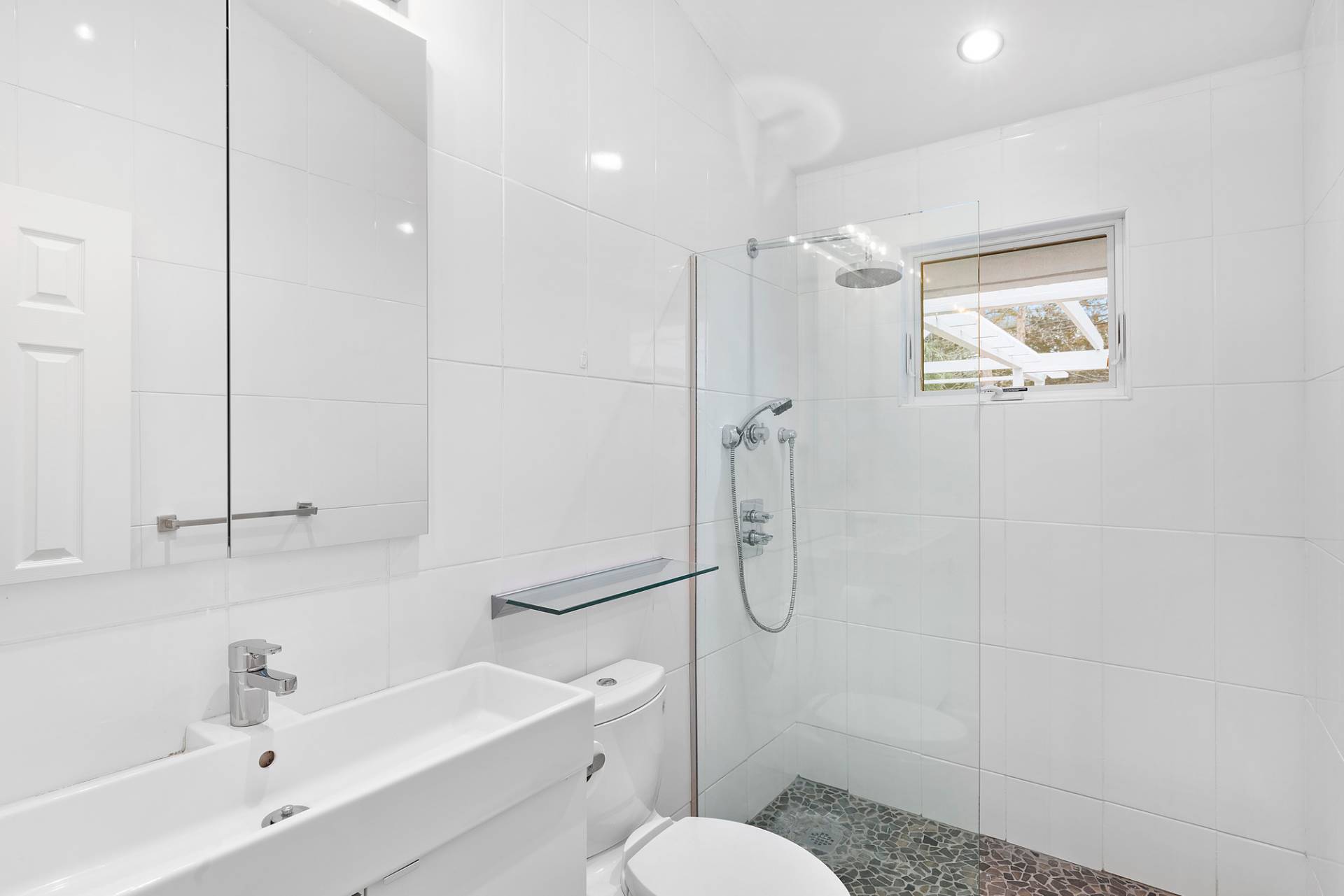 34 Fenmarsh Road East Hampton, NY 11937 - Photo 12 of 16 a bathroom with a sink a toilet and shower