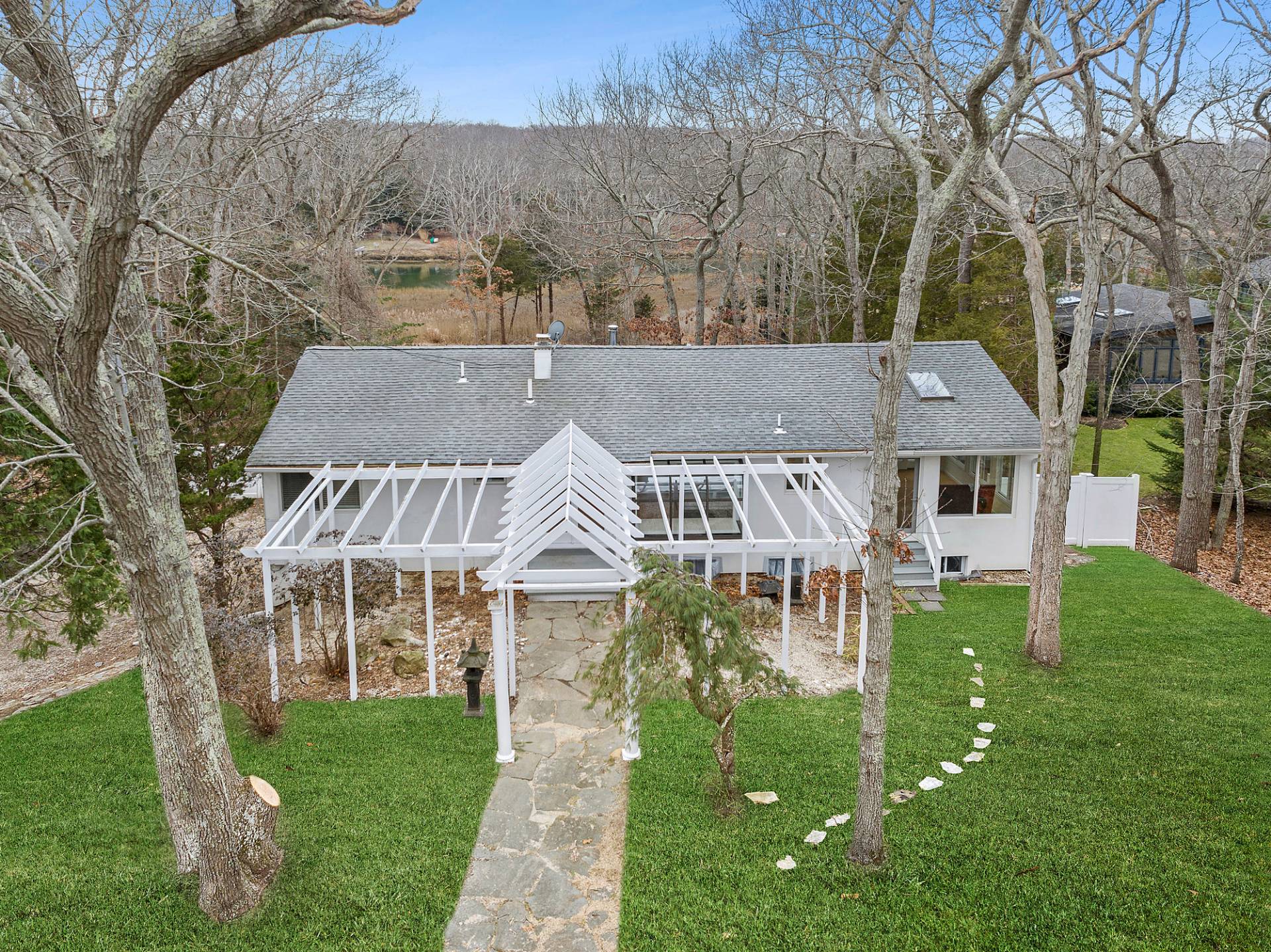34 Fenmarsh Road East Hampton, NY 11937 - Photo 2 of 16 front view of house with a yard