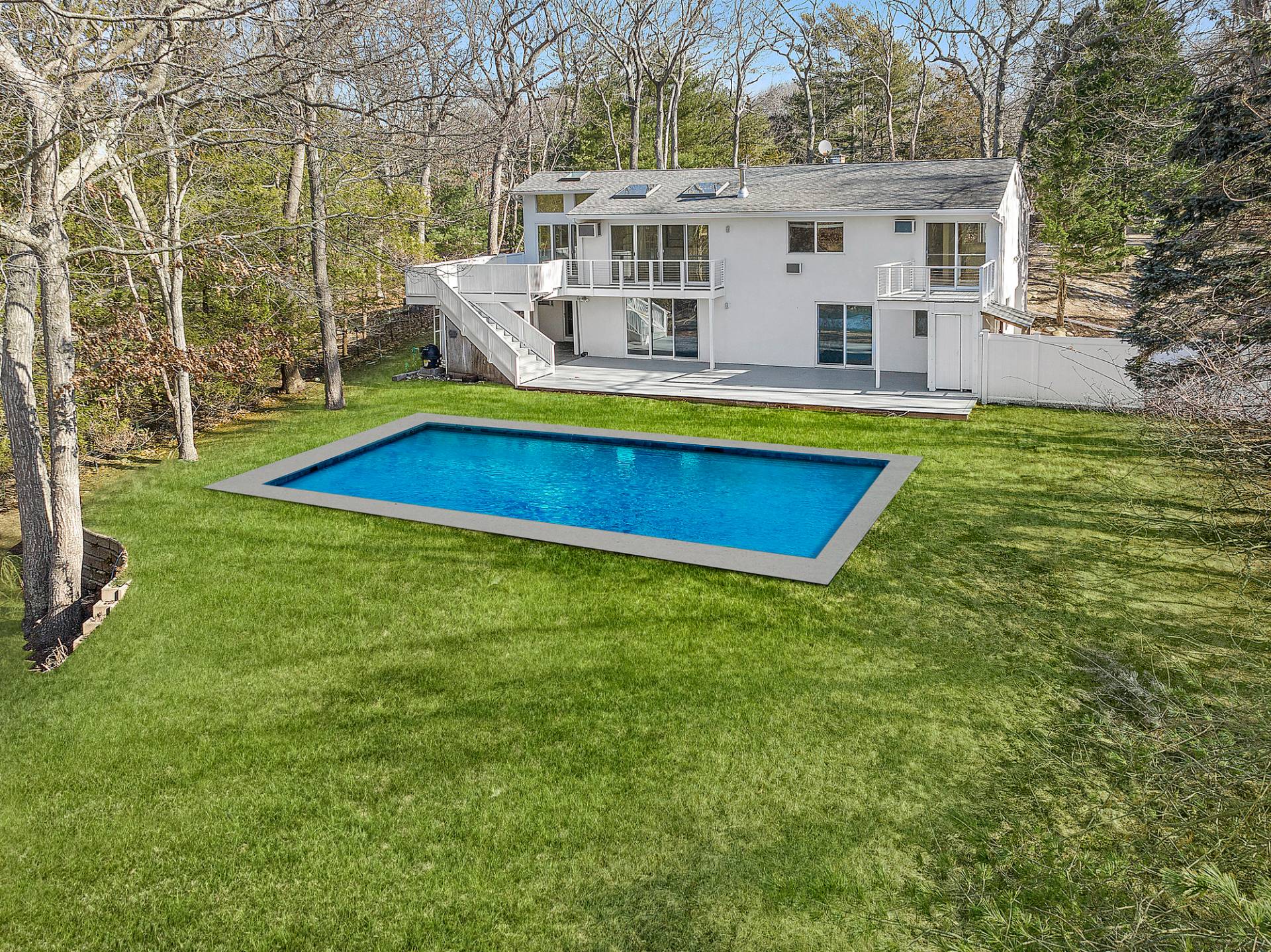 34 Fenmarsh Road East Hampton, NY 11937 - Photo 5 of 16 a view of a house with swimming pool