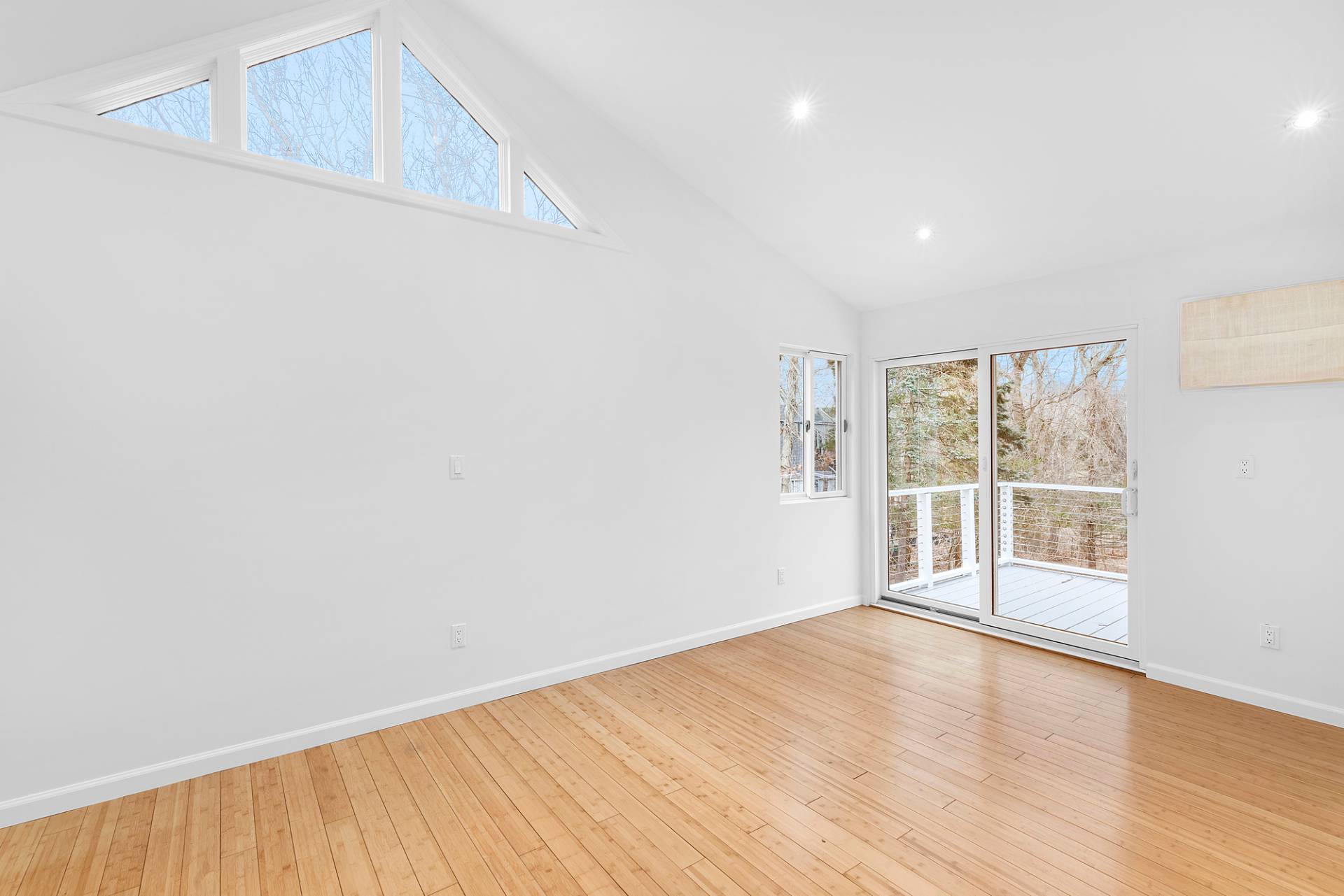 34 Fenmarsh Road East Hampton, NY 11937 - Photo 9 of 16 a view of an empty room with wooden floor and a window