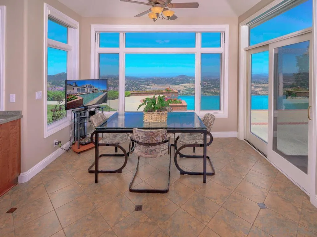 14490 Ridge Ranch Road Escondido, CA 92027 - Photo 15 of 74 a dining room with furniture and a floor to ceiling window