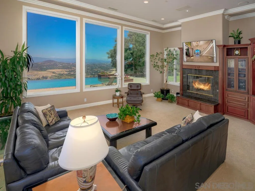 14490 Ridge Ranch Road Escondido, CA 92027 - Photo 16 of 74 a living room with furniture and a fireplace