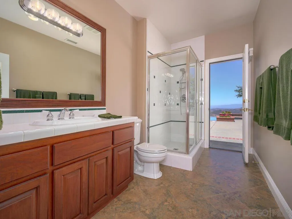 14490 Ridge Ranch Road Escondido, CA 92027 - Photo 27 of 74 a bathroom with a sink a toilet and shower