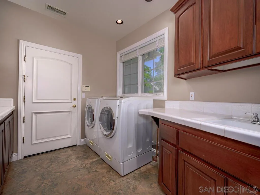 14490 Ridge Ranch Road Escondido, CA 92027 - Photo 28 of 74 a utility room with dryer and washer