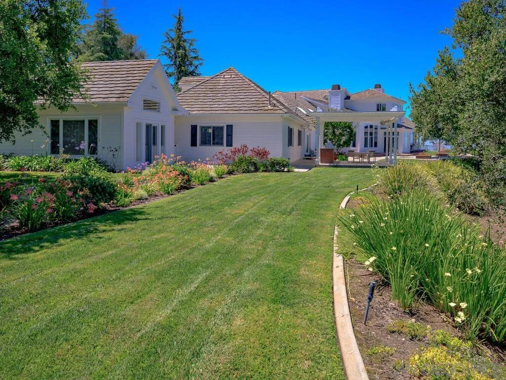 14490 Ridge Ranch Road Escondido, CA 92027 - Photo 35 of 74 a front view of a house with a yard