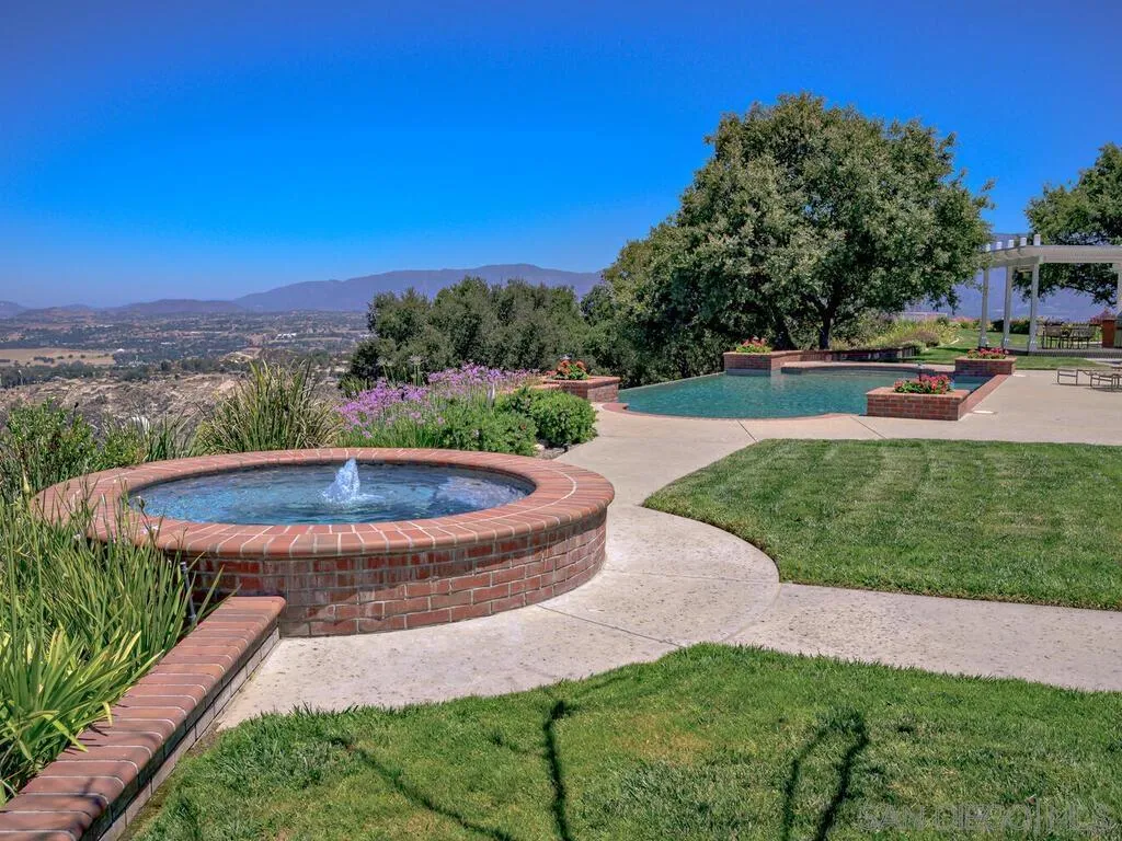 14490 Ridge Ranch Road Escondido, CA 92027 - Photo 45 of 74 a view of a garden with a fountain