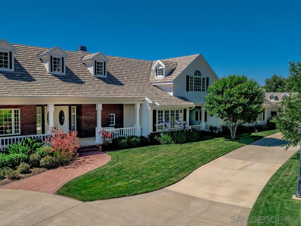 14490 Ridge Ranch Road Escondido, CA 92027 - Photo 7 of 74 a front view of a house with a yard and porch