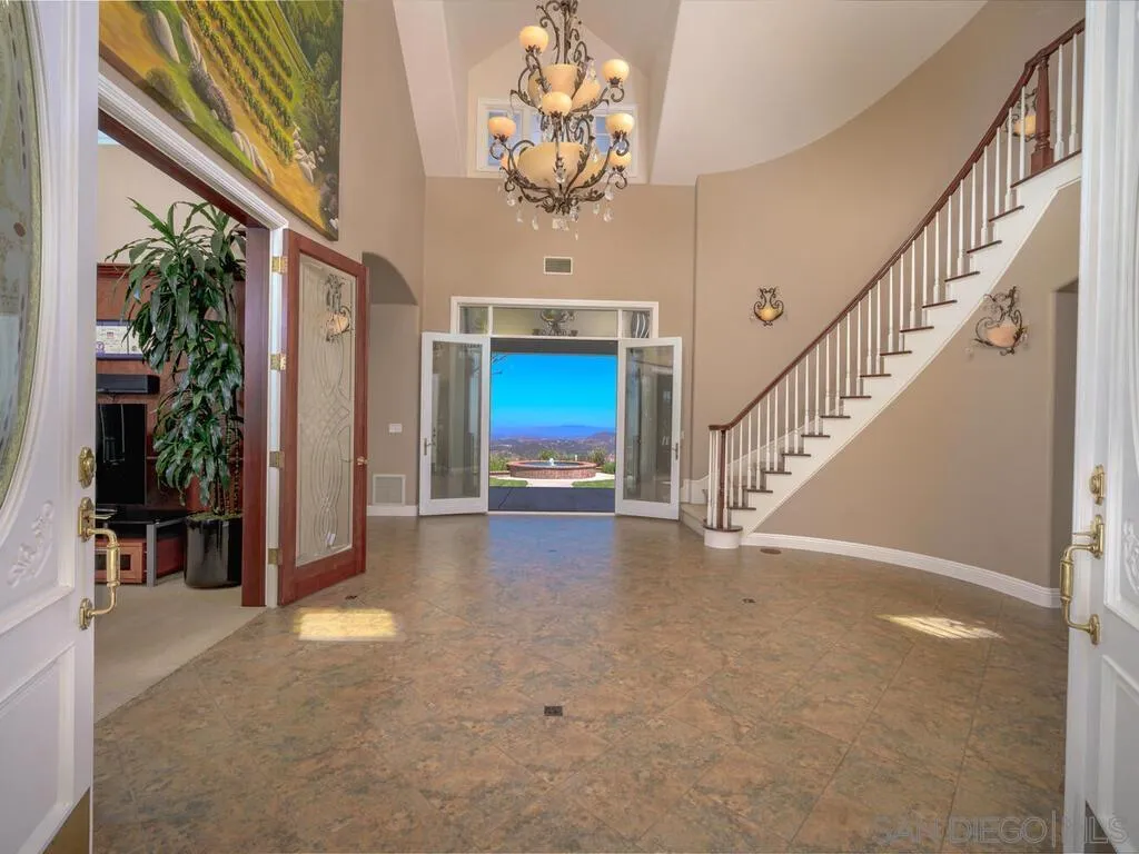 14490 Ridge Ranch Road Escondido, CA 92027 - Photo 9 of 74 a view of entryway and hall with a chandelier