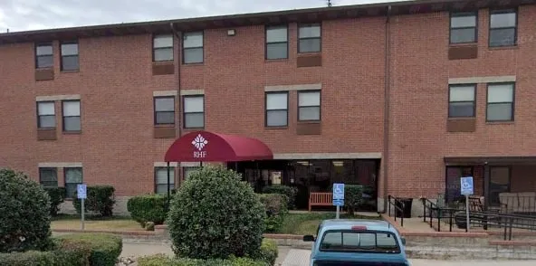 a front view of houses with yard