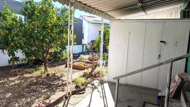 a view of a house with wooden floor and outdoor seating