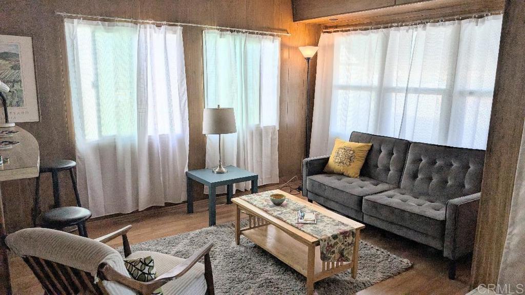 9459 Mission Gorge Road, Unit 68 Santee, CA 92071 - Photo 2 of 13 a living room with furniture and a window