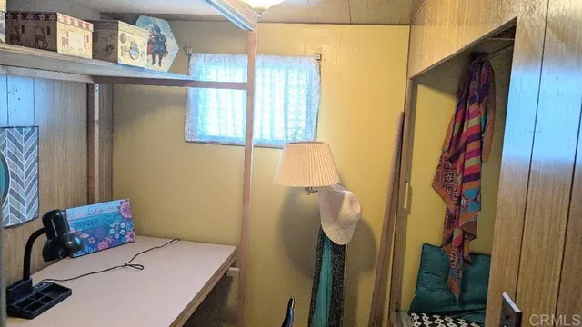 a bedroom with a bed and a table in it