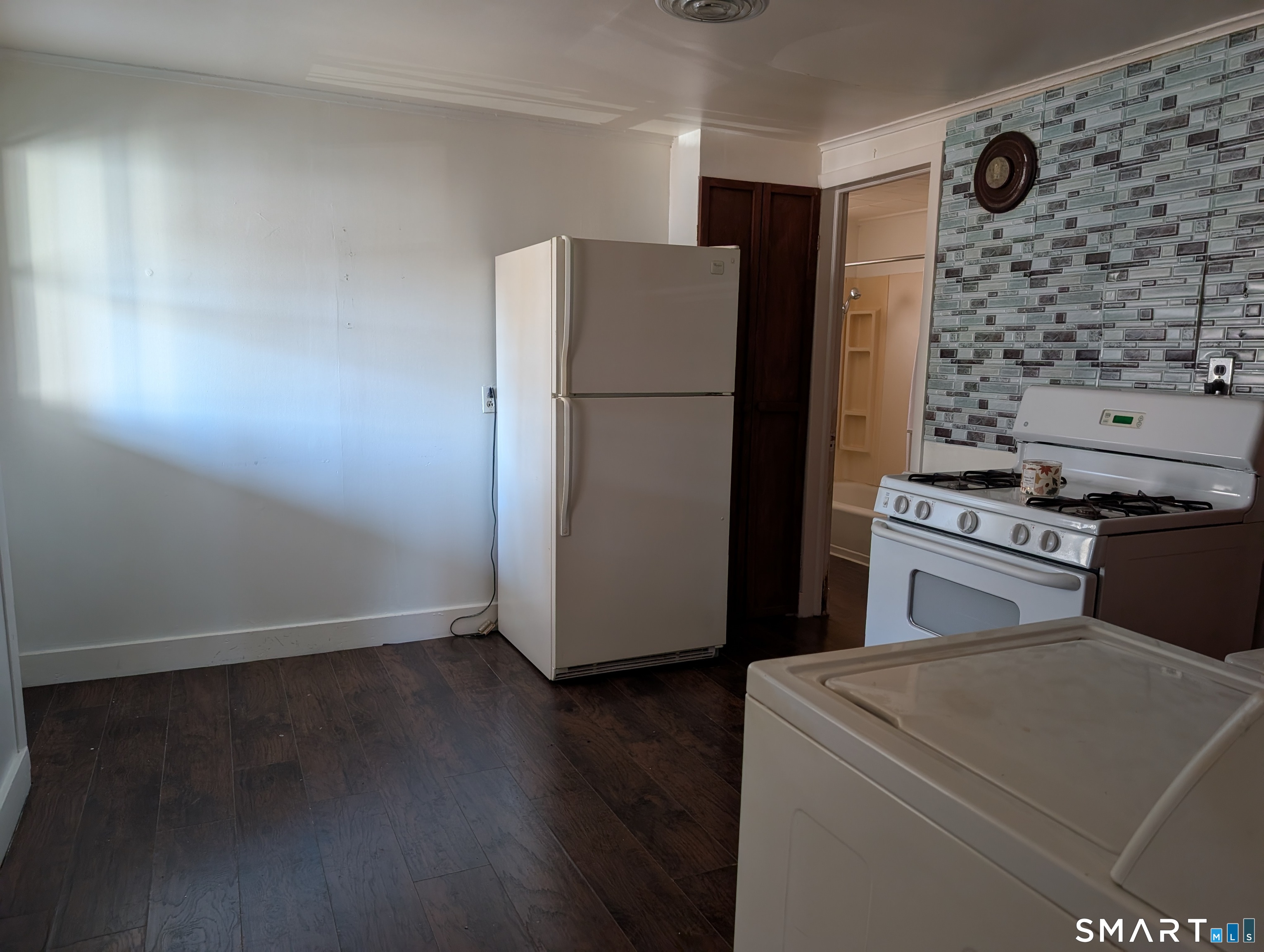 48 Anderson Street Naugatuck, CT 06770 - Photo 11 of 17 a kitchen with a refrigerator and a stove top oven