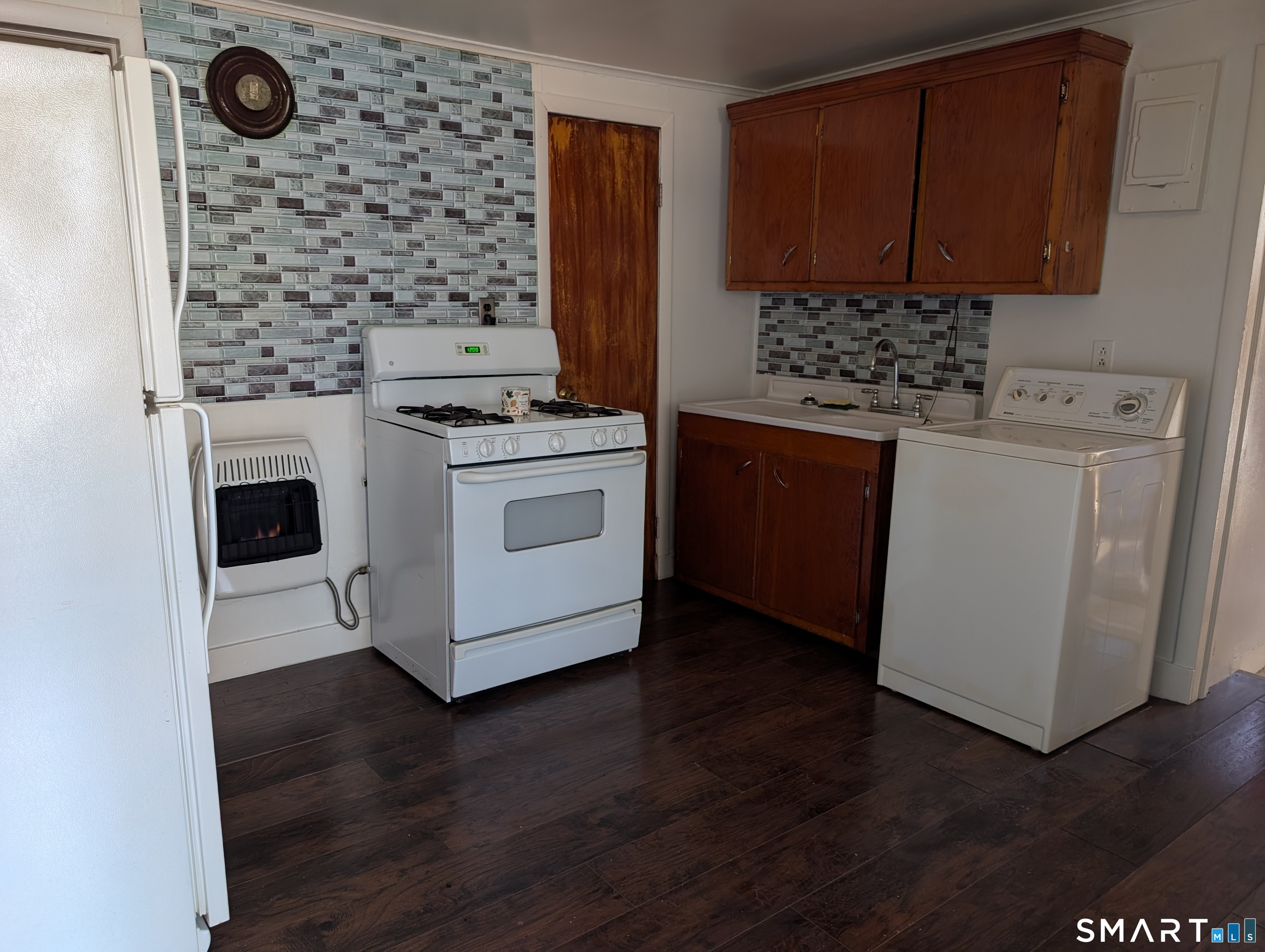 48 Anderson Street Naugatuck, CT 06770 - Photo 12 of 17 a kitchen with a stove and a microwave