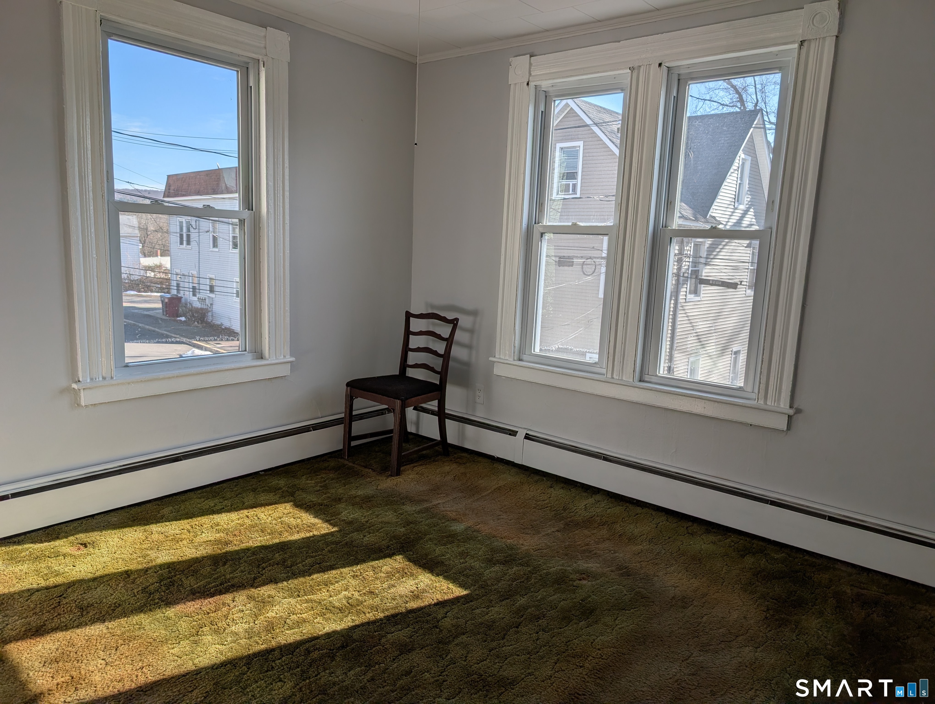 48 Anderson Street Naugatuck, CT 06770 - Photo 16 of 17 a view of an empty room with a window and wooden floor