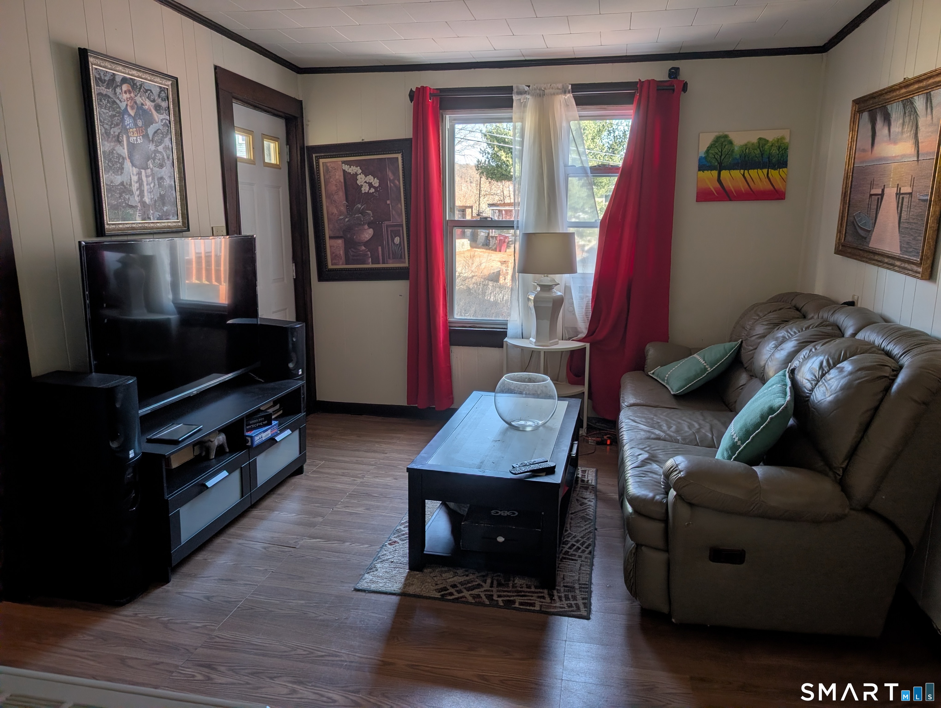 48 Anderson Street Naugatuck, CT 06770 - Photo 6 of 17 a living room with furniture and a flat screen tv