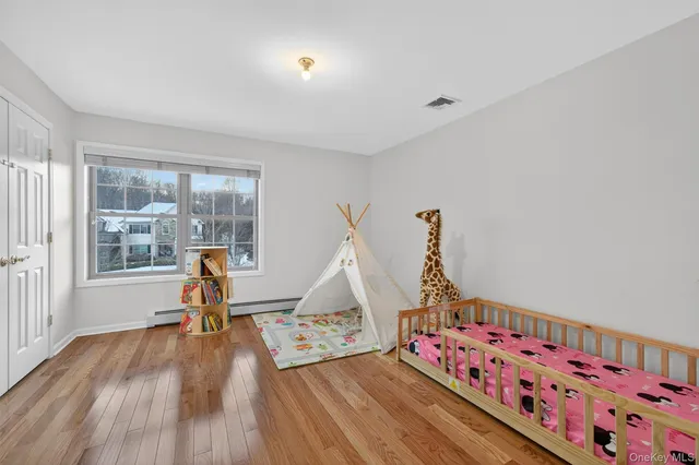 a view of room with wooden floor and workspace
