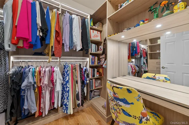 a bathroom with a granite countertop tub sink and mirror