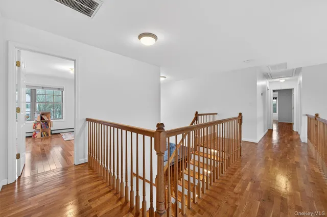 a bathroom with a granite countertop sink a toilet and bathtub