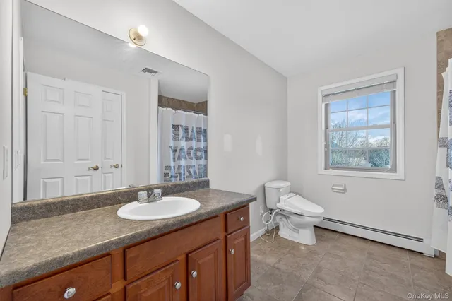 a view of house with outdoor space and sitting area