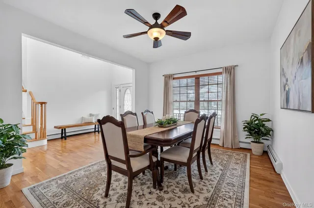 a view of a dining room with furniture and window