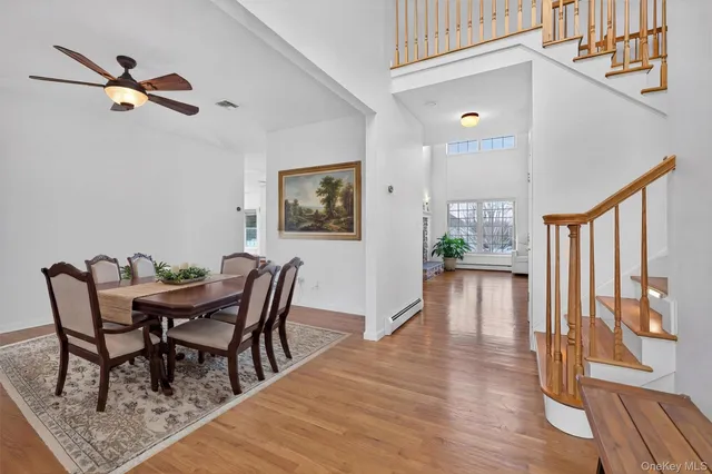 a view of a dining room with furniture window and wooden floor