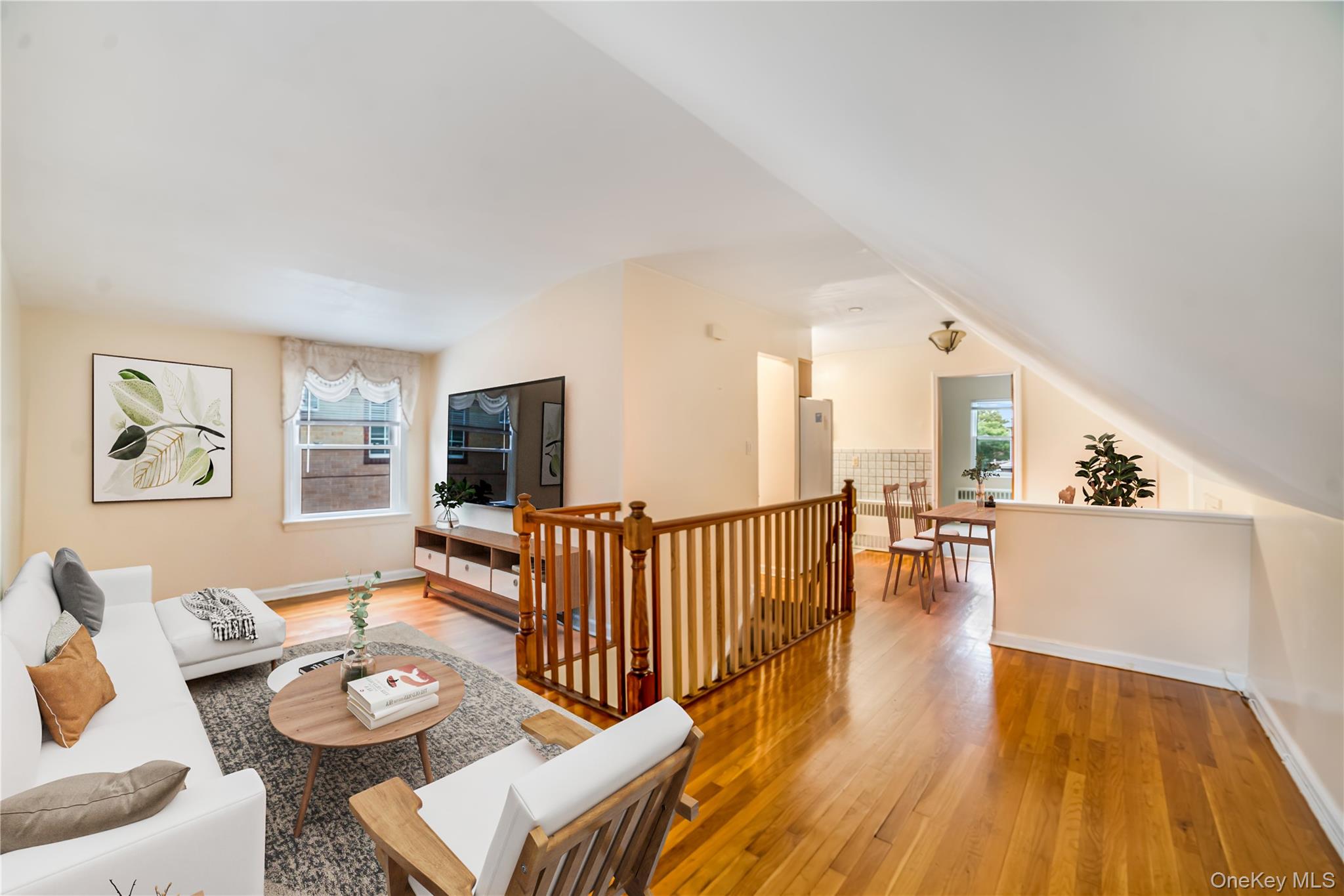 77-19 252nd Street Queens, NY 11426 - Photo 13 of 27 a living room with furniture and a wooden floor