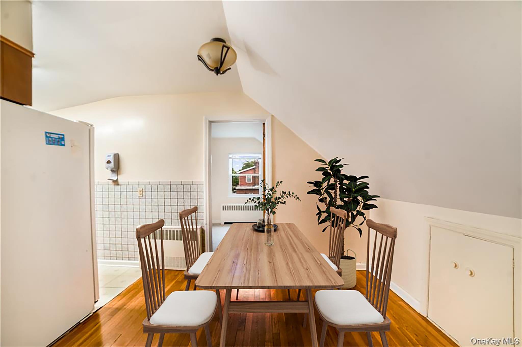 77-19 252nd Street Queens, NY 11426 - Photo 15 of 27 a dining room with furniture and wooden floor