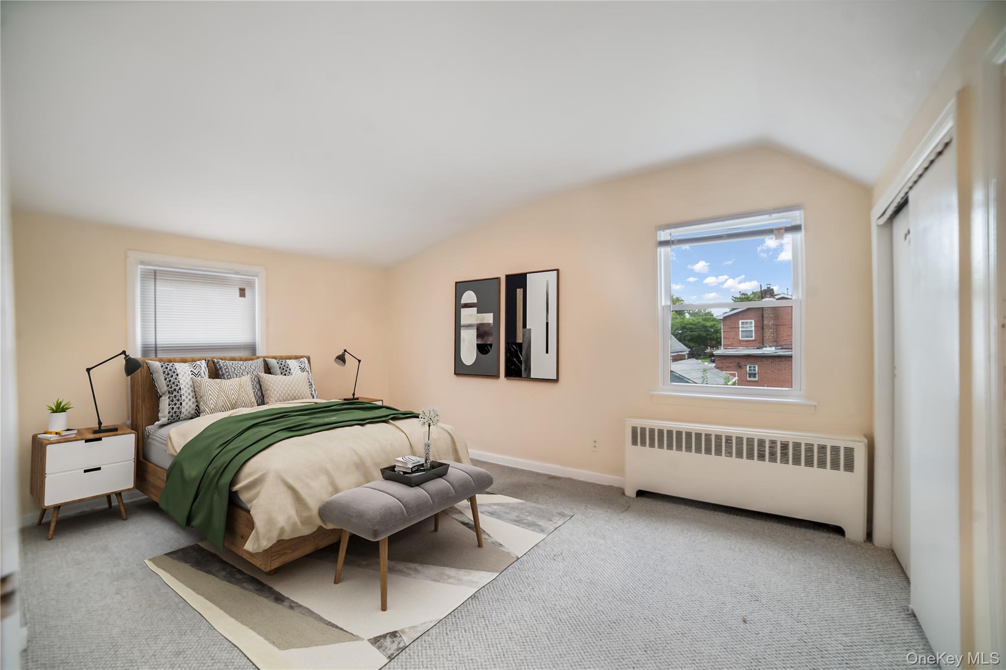 77-19 252nd Street Queens, NY 11426 - Photo 17 of 27 a spacious bedroom with a bed and a window