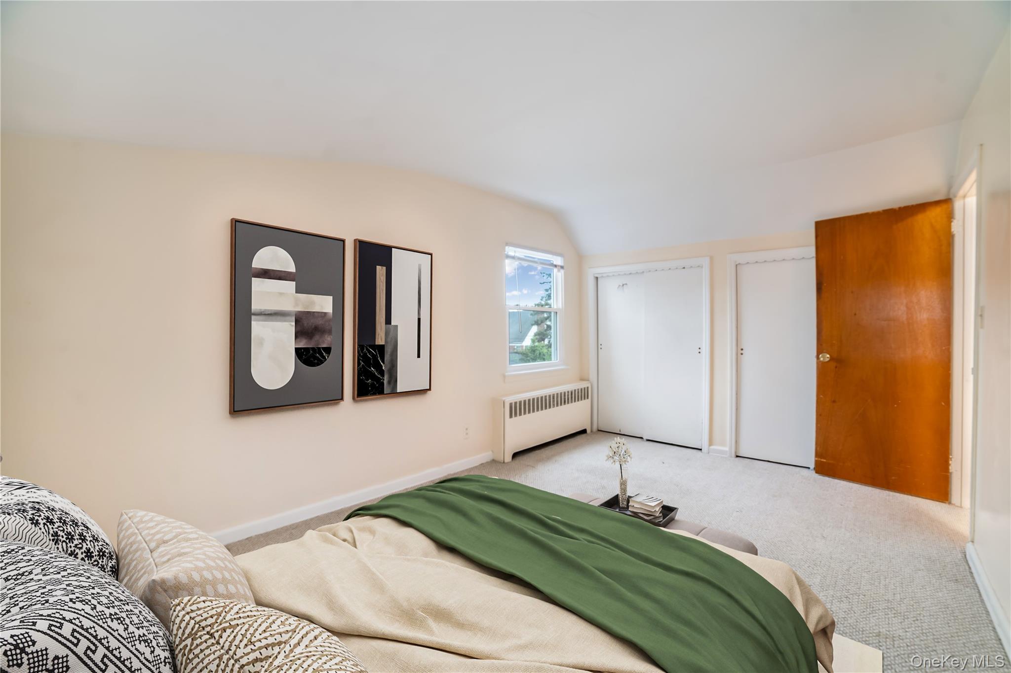 77-19 252nd Street Queens, NY 11426 - Photo 18 of 27 a bedroom with a bed and a mirror