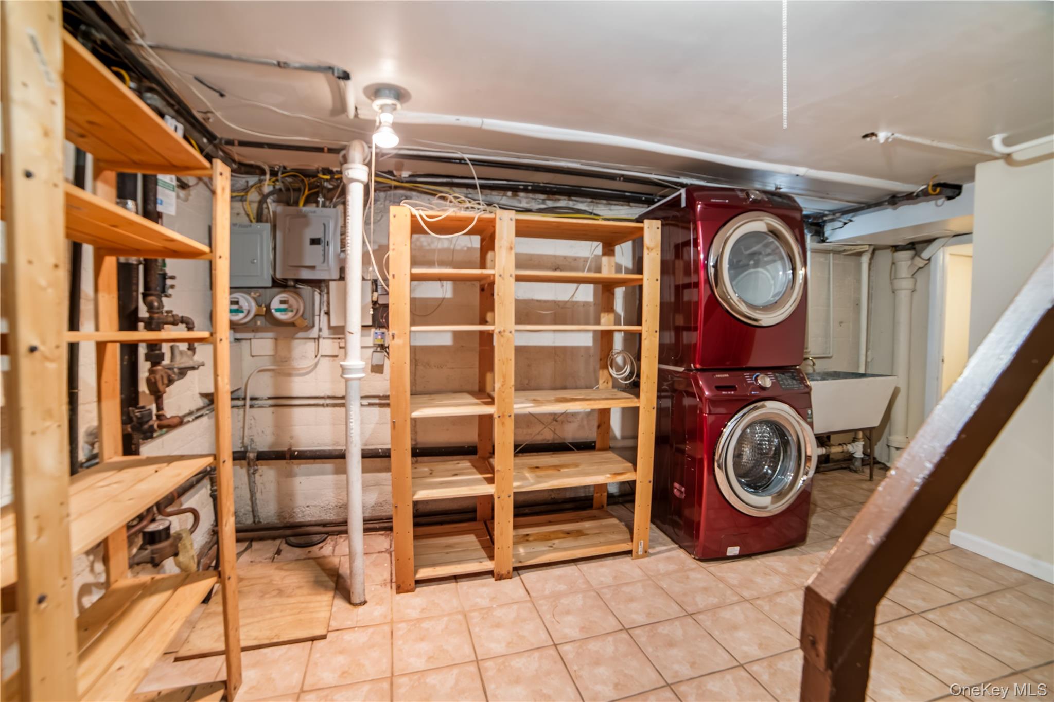 77-19 252nd Street Queens, NY 11426 - Photo 24 of 27 a view of a storage and utility room with washer and dryer