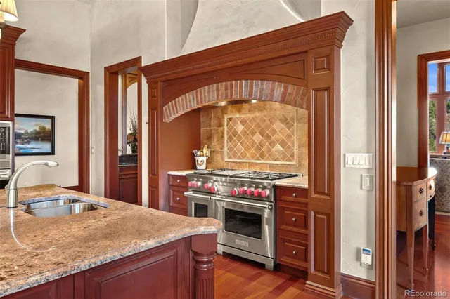 a kitchen with a stove and a sink